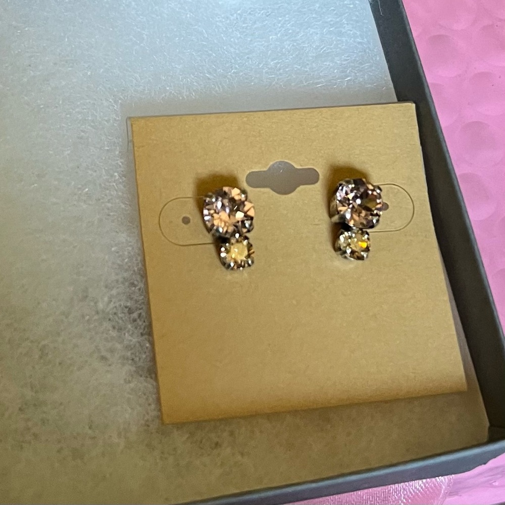 11 pairs of 2 stone stud earrings, 20 each. Silver metal, blush/champagne stones